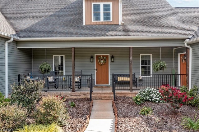 view of exterior entry featuring a porch