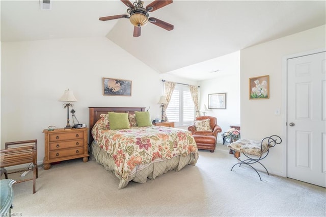 bedroom featuring carpet floors, lofted ceiling, and ceiling fan