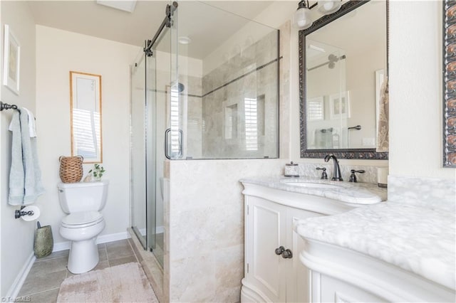 bathroom with vanity, toilet, tile patterned floors, and walk in shower