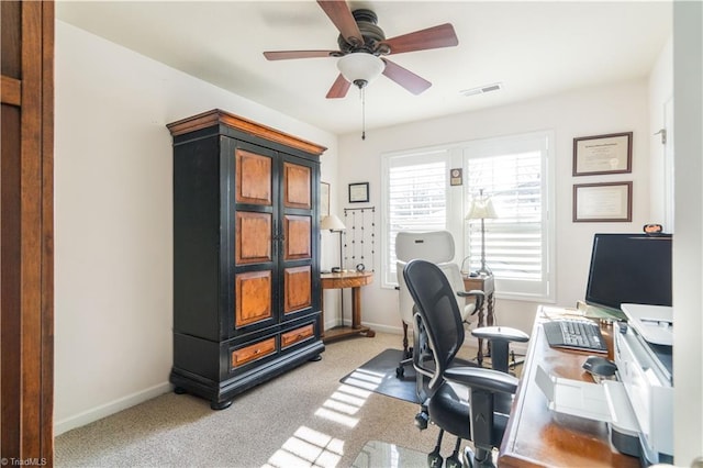 office featuring light carpet and ceiling fan