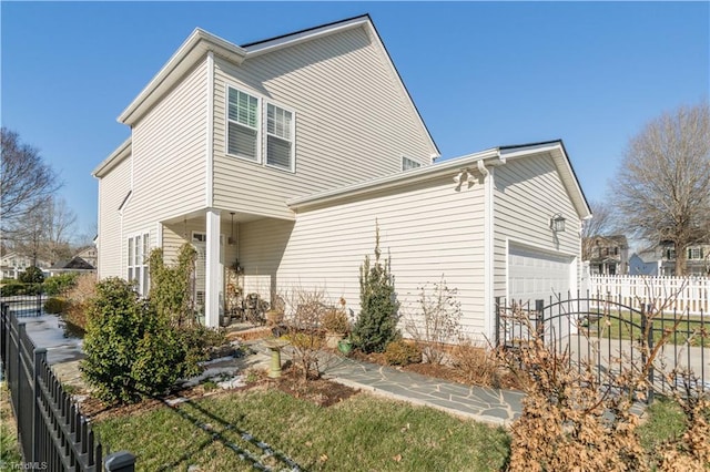 view of side of property with a garage