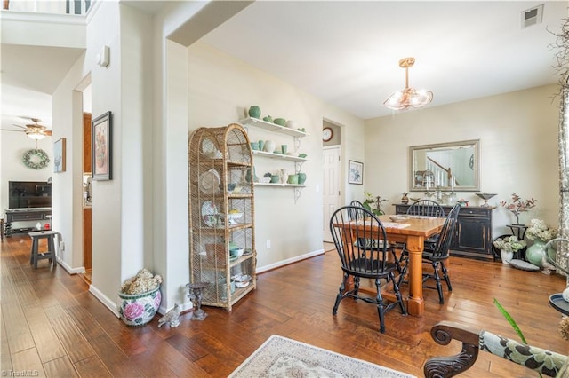 dining area featuring dark hardwood / wood-style floors and ceiling fan