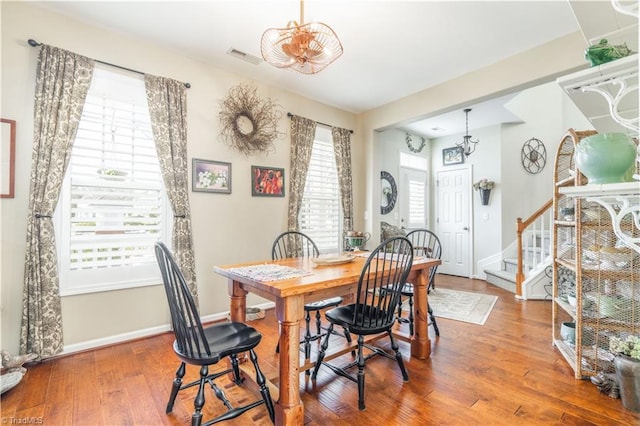 dining area featuring hardwood / wood-style flooring