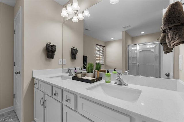 1318 Reading Ct, Burlington, NC 27217 - full bathroom featuring double vanity, a sink, visible vents, and a shower stall