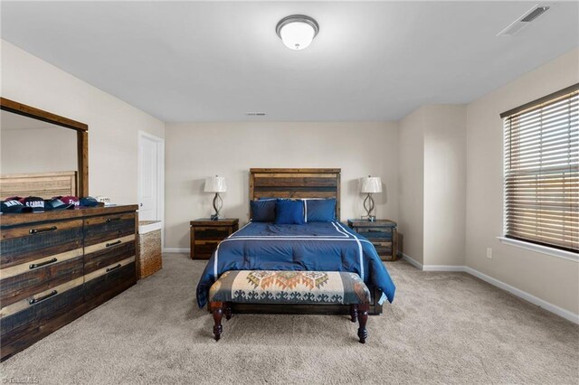 1318 Reading Ct, Burlington, NC 27217 - carpeted bedroom featuring visible vents and baseboards