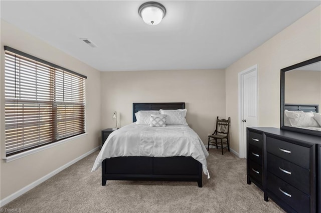 1318 Reading Ct, Burlington, NC 27217 - bedroom featuring visible vents, light carpet, and baseboards