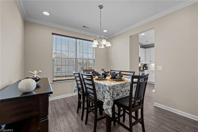 1318 Reading Ct, Burlington, NC 27217 - dining area featuring dark wood-style flooring, recessed lighting, visible vents, ornamental molding, and baseboards