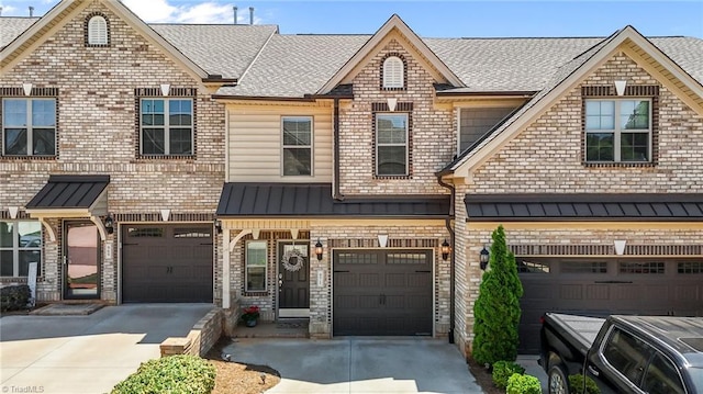 971 Bonanza Ln, Mebane, NC 27302 - multi unit property with driveway, an attached garage, a standing seam roof, and a shingled roof