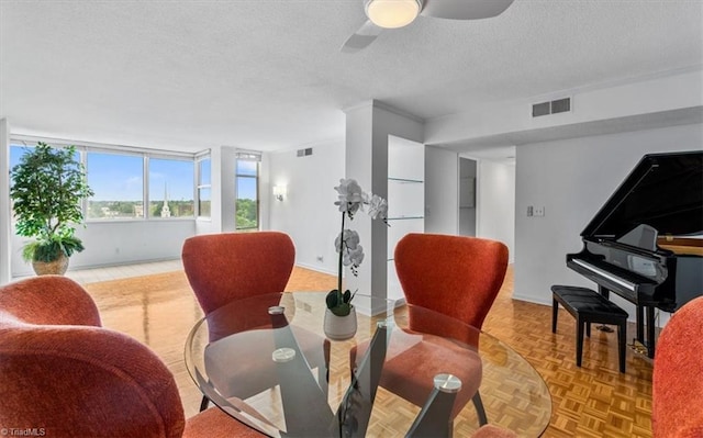 1101 N Elm St Unit 902, Greensboro, NC 27401 - dining room featuring baseboards, a textured ceiling, and a ceiling fan