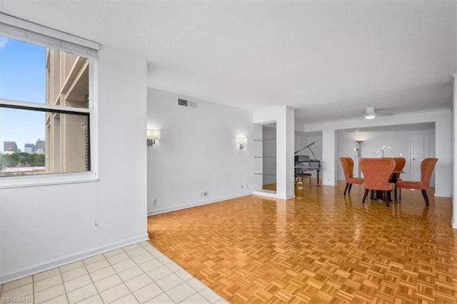 1101 N Elm St Unit 902, Greensboro, NC 27401 - living area featuring a ceiling fan and baseboards