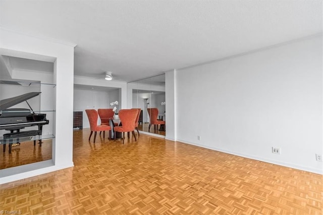 1101 N Elm St Unit 902, Greensboro, NC 27401 - dining room with baseboards and ceiling fan