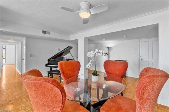 1101 N Elm St Unit 902, Greensboro, NC 27401 - dining room with a textured ceiling and ceiling fan