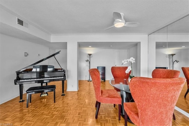 1101 N Elm St Unit 902, Greensboro, NC 27401 - dining area featuring a textured ceiling, ceiling fan, crown molding, and baseboards