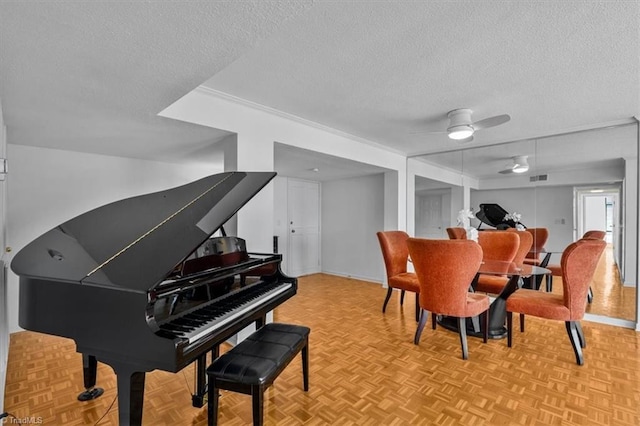 1101 N Elm St Unit 902, Greensboro, NC 27401 - living area with a textured ceiling, baseboards, and a ceiling fan
