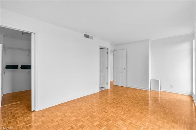 1101 N Elm St Unit 902, Greensboro, NC 27401 - unfurnished bedroom with a spacious closet, baseboards, and a closet