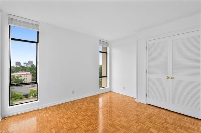 1101 N Elm St Unit 902, Greensboro, NC 27401 - unfurnished bedroom featuring baseboards