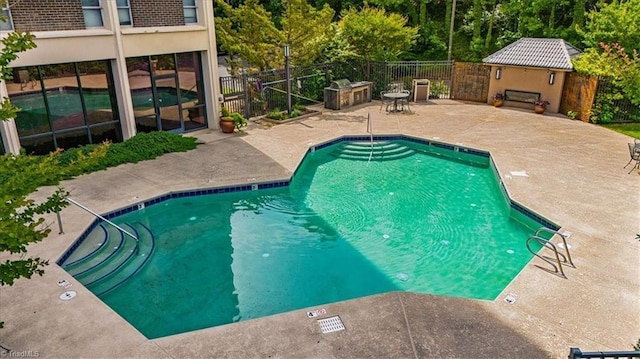 1101 N Elm St Unit 902, Greensboro, NC 27401 - community pool with a patio area and fence
