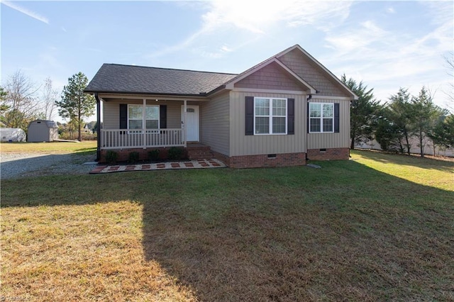 view of front of home with covered porch and a front lawn