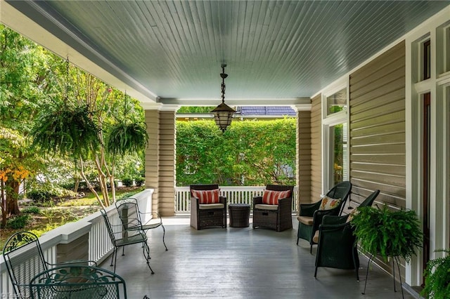 view of patio featuring an outdoor living space and a porch