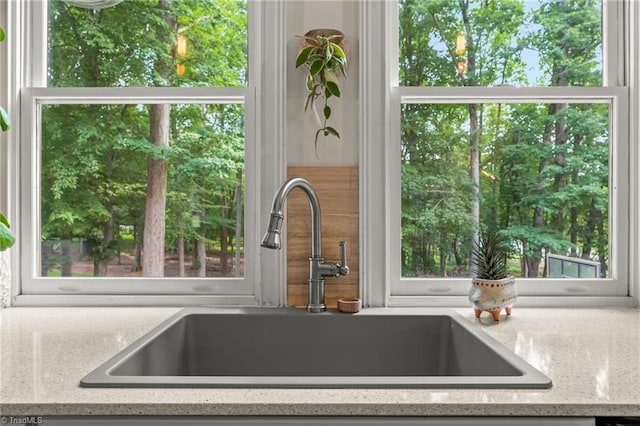 2020 La Dora Dr, High Point, NC 27265 - kitchen view of a sink and light stone counters