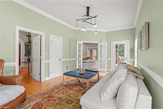 2020 La Dora Dr, High Point, NC 27265 - living room featuring french doors, crown molding, and wood finished floors