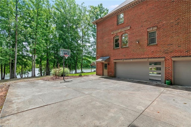 2020 La Dora Dr, High Point, NC 27265 - view of property exterior with a garage, concrete driveway, and brick siding