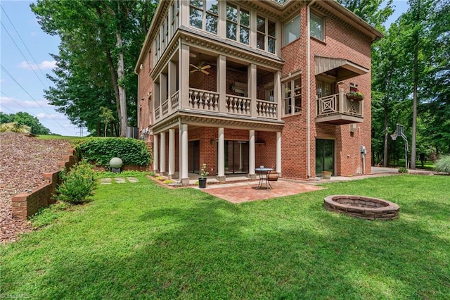 2020 La Dora Dr, High Point, NC 27265 - back of property with a balcony, a patio area, a yard, brick siding, and a ceiling fan