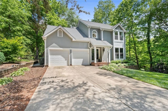 view of front of house featuring concrete driveway and an attached garage