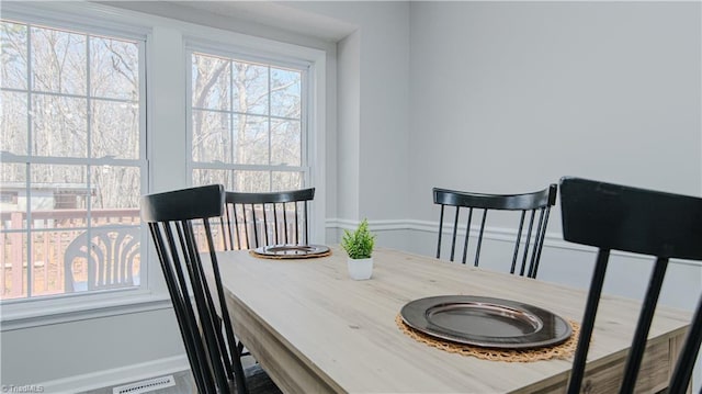 dining area featuring visible vents