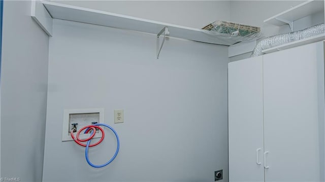 laundry room featuring cabinet space, hookup for an electric dryer, and washer hookup