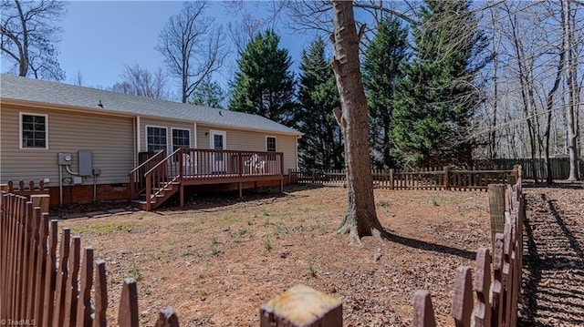 back of house with crawl space, fence, and a wooden deck