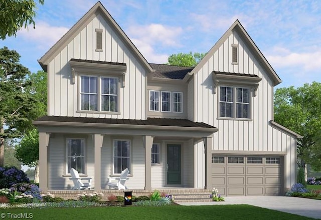 modern farmhouse featuring a garage and a front yard