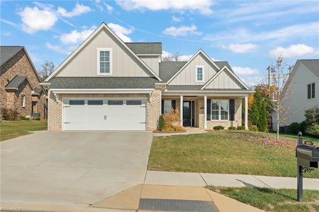 craftsman house with a garage and a front yard