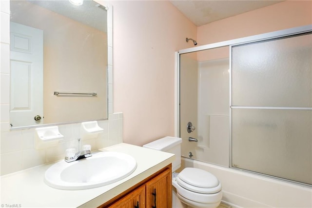 201 Olde Vineyard Ct, Winston-Salem, NC 27104 - bathroom featuring vanity, shower / bath combination with glass door, and decorative backsplash