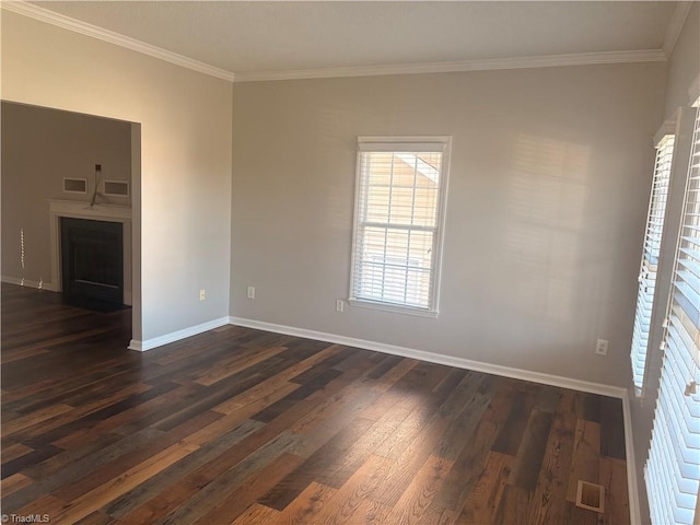 unfurnished room featuring dark hardwood / wood-style floors and ornamental molding