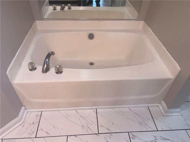 bathroom with a tub