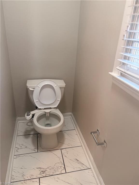 bathroom featuring toilet