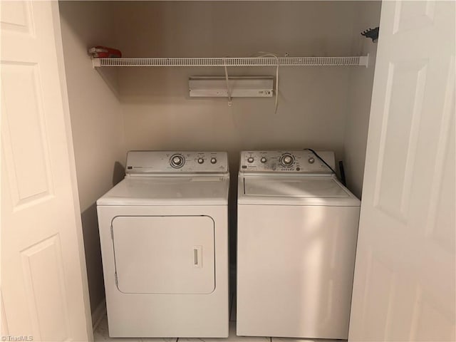 clothes washing area with independent washer and dryer