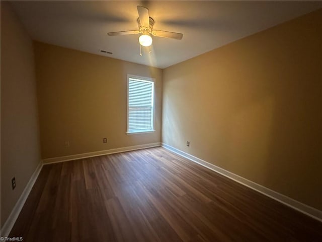 4727 Eagle Path, Winston-Salem, NC 27127 - empty room featuring dark wood-type flooring, baseboards, and a ceiling fan