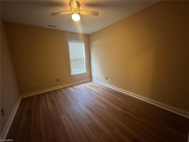 4727 Eagle Path, Winston-Salem, NC 27127 - spare room featuring dark wood-style flooring, baseboards, and ceiling fan