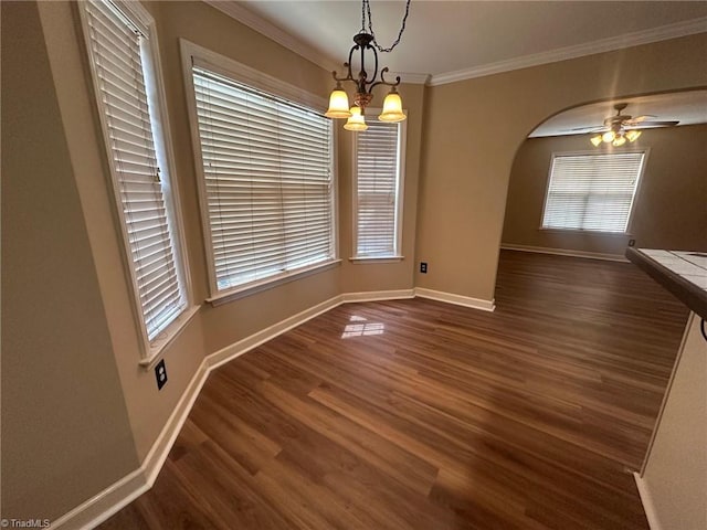 4727 Eagle Path, Winston-Salem, NC 27127 - unfurnished dining area featuring arched walkways, crown molding, baseboards, and plenty of natural light