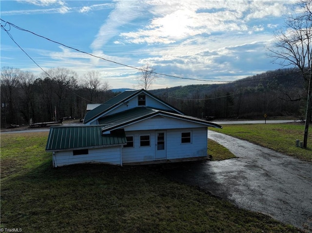 view of home's exterior with a lawn