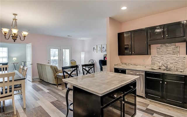 6801 Hanesbrook Cir Unit 104, Clemmons, NC 27012 - kitchen featuring stainless steel dishwasher, dark cabinets, light countertops, and recessed lighting