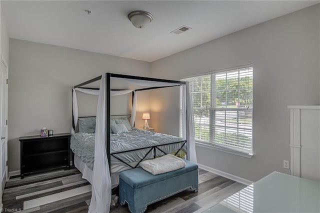 6801 Hanesbrook Cir Unit 104, Clemmons, NC 27012 - bedroom featuring wood finished floors and baseboards