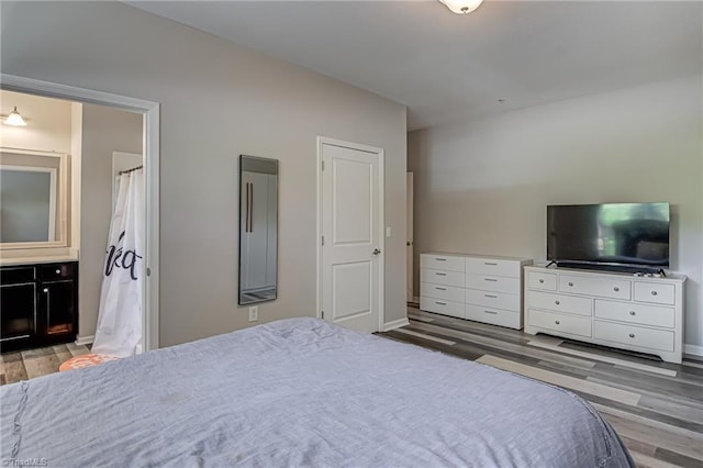 6801 Hanesbrook Cir Unit 104, Clemmons, NC 27012 - bedroom featuring wood finished floors and baseboards