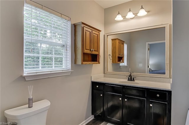 6801 Hanesbrook Cir Unit 104, Clemmons, NC 27012 - ensuite bathroom featuring vanity, toilet, and baseboards