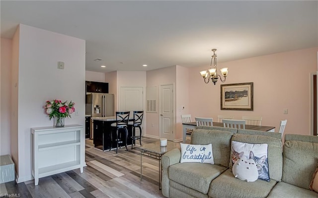 6801 Hanesbrook Cir Unit 104, Clemmons, NC 27012 - living room with a chandelier, wood finished floors, recessed lighting, and baseboards