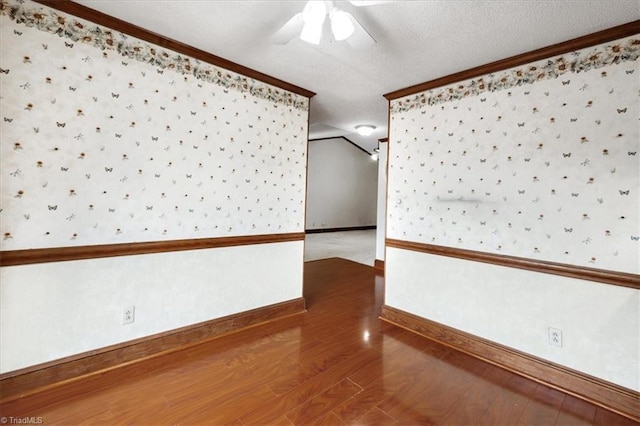 206 Swaim Ct, Salisbury, NC 28147 - unfurnished room featuring crown molding, baseboards, ceiling fan, wood finished floors, and wallpapered walls