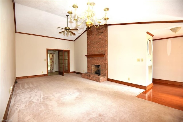 unfurnished living room with high vaulted ceiling, ceiling fan with notable chandelier, crown molding, light wood-type flooring, and a fireplace