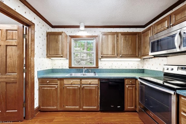 206 Swaim Ct, Salisbury, NC 28147 - kitchen with appliances with stainless steel finishes, wallpapered walls, crown molding, a textured ceiling, and wood finished floors
